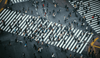 High Angle View Of People On a City Street crossing for UK Justice System at a crossroads concept