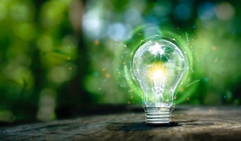 Lightbulb with green background as concept for purpose-aligned value proposition design