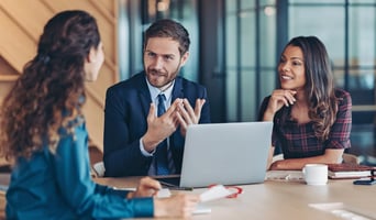 Businessman explaining a concept to his colleagues stock photo as concept for navigating AI in the legal sector