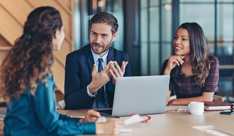 Image for Businessman explaining a concept to his colleagues stock photo as concept for navigating AI in the legal sector