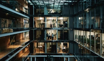 Modern office building by night in Paris, France stock photo as organisational culture adapting due to AI concept