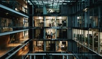 Modern office building by night in Paris, France stock photo as organisational culture adapting due to AI concept