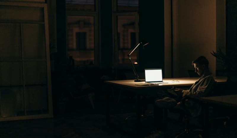 Image for Man in dark room with light on working as shadow AI concept stock image