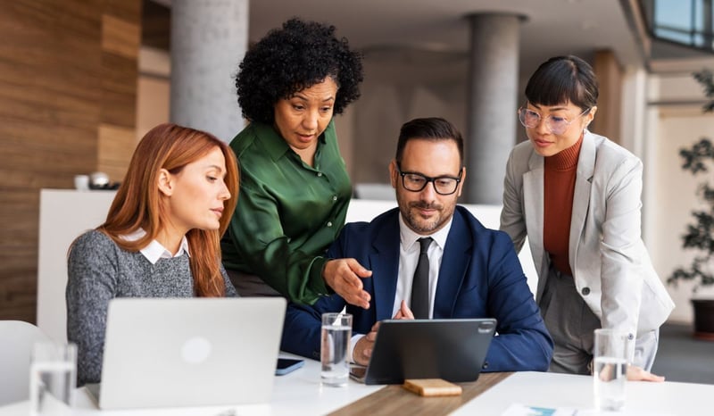 Image for Team Collaboration Meeting in a Modern Office Setting as performance management in purpose driven organisations, team reviewing how to turn purpose into measurable impact conceptstock photo