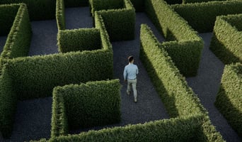 Business man walking in a maze as concept for e-invoicing challenges