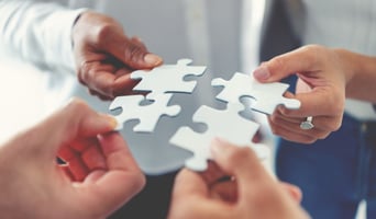 Group of business people holding a jigsaw puzzle pieces. Business solution integration merger concept stock photo