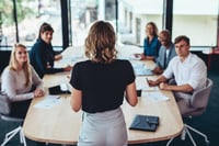Business woman running meeting stock photo for leadership guiding GenAI transition concept 