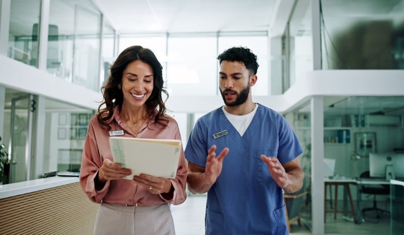 Image for Hospital chief, teamwork and planning with doctor and woman for documents, schedule and feedback. Consultant, advice and medical with people in clinic for healthcare compliance, nurse and insurance healthcare employee experience stock photo.jpg