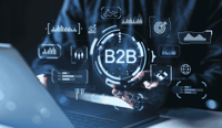 B2B technology interface with digital marketing and data analytics icons surrounding businessman using smartphone and laptop in business concept. stock photo.jpg
