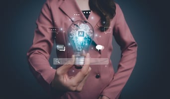AI Artificial Intelligence. Woman using command prompt for generates something. A businesswoman holding a glowing light bulb with the letters AI inside it. Futuristic technology transformation. stock photo