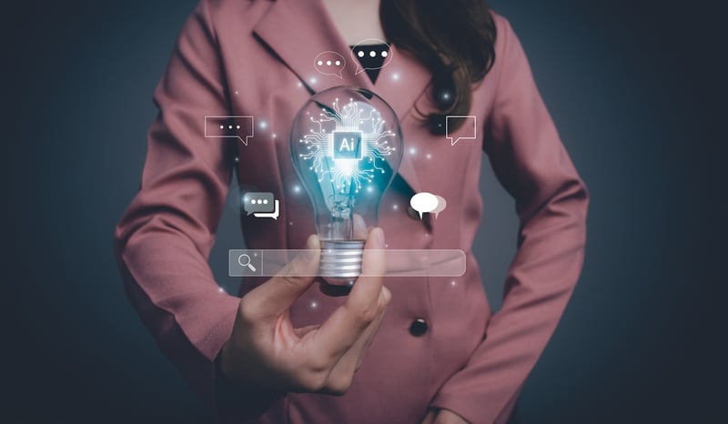Image for AI Artificial Intelligence. Woman using command prompt for generates something. A businesswoman holding a glowing light bulb with the letters AI inside it. Futuristic technology transformation. stock photo
