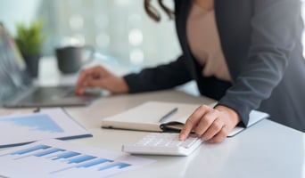 Businesswoman sitting planning analyze investment and marketing on the desk in the office as Revenue Cycle Management (RCM) concept stock photo