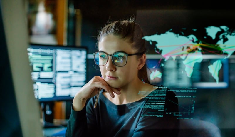 Image for Woman sat at a computer to signify unlocking AI stock photo