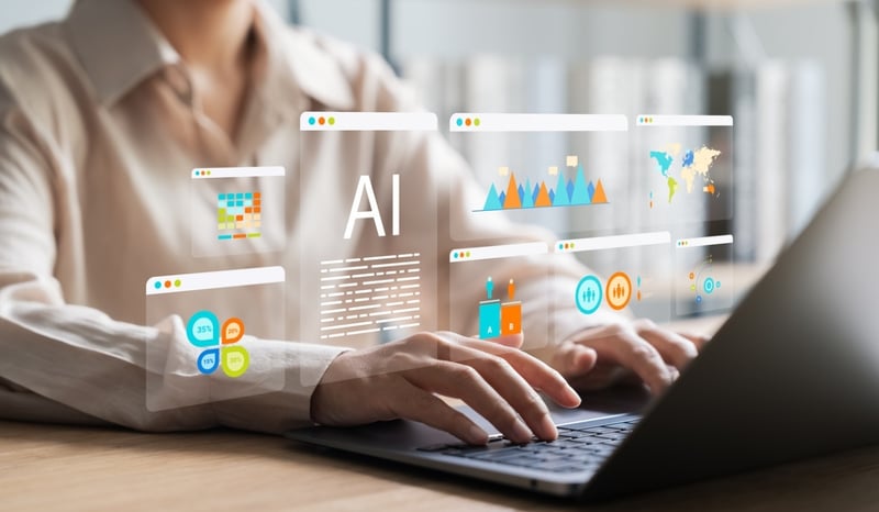 Image for Woman sitting at desk using AI as o-intelligence in practice: Mastering AI augmentation concept