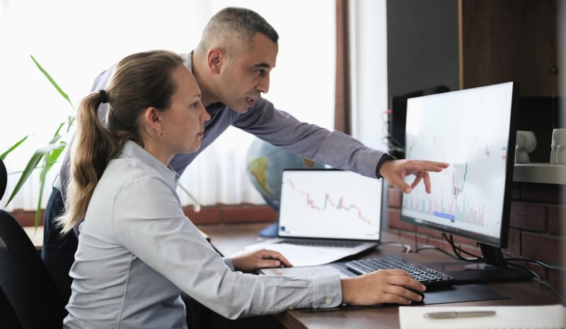 Image for Businesspeople working in the office on stock market exchange data using desktop computer and digital tablet or public sector officials reviewing the spending review on computer conceptstock photo