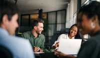 Group of young multi-ethnic startup business team collaborating on project in modern office as purpose led team high performance culture concept stock photo