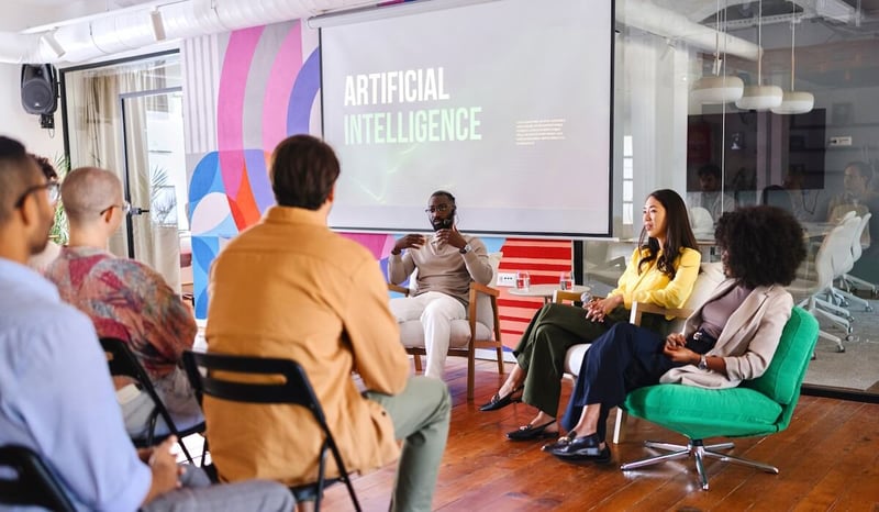 Image for Colleagues talking about AI at product management panel stock photo
