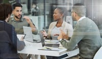 Shot of a group of businesspeople having a meeting in an office at work stock photo