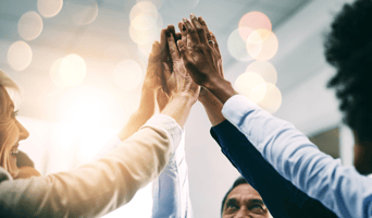 Closeup, high five and business people with support, hands and collaboration with mission, achievement or cooperation. Staff, group or corporate professionals with teamwork, bokeh or celebration stock photo.jpg