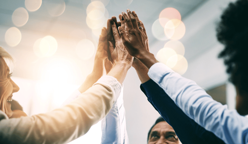 Image for Closeup, high five and business people with support, hands and collaboration with mission, achievement or cooperation. Staff, group or corporate professionals with teamwork, bokeh or celebration stock photo.jpg