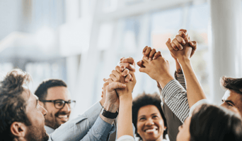 Sea of hands in unity used as featured image of Practical tips for fostering psychological safety in the workplace podcast