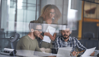 Workers looking at account-based marketing ABM strategy on computer stock photo