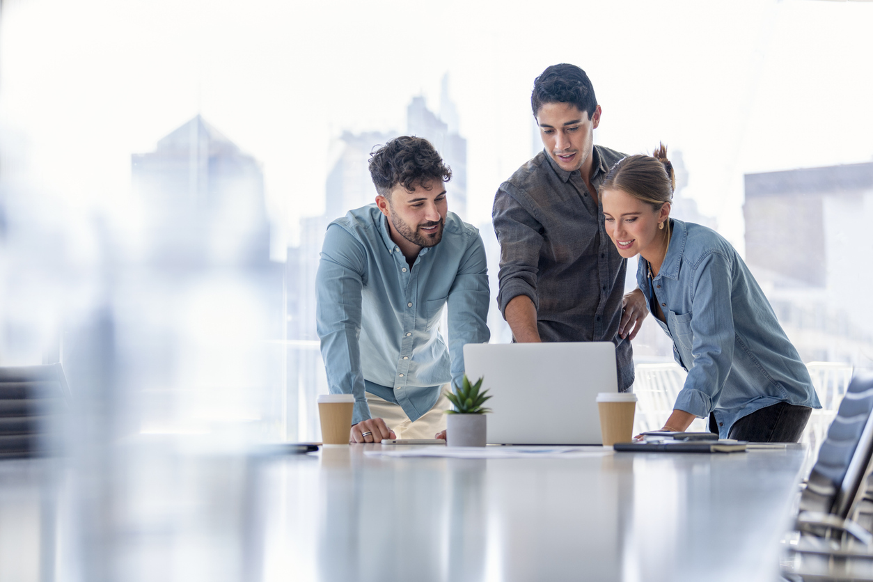 Business team working on a laptop computer stock photo